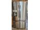 Stainless steel refrigerator featuring a three-door design with water and ice dispenser at 1586 S Lawther Dr, Apache Junction, AZ 85120