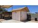 A view of the shed featuring durable construction in a well-maintained backyard space at 1586 S Lawther Dr, Apache Junction, AZ 85120