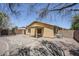 This backyard features an outdoor space with stone pavers and a covered patio at 16159 W Maui Ln, Surprise, AZ 85379