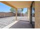 Backyard with covered patio, pavers, and gravel, offering a versatile outdoor living space at 16159 W Maui Ln, Surprise, AZ 85379