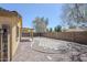 Spacious backyard featuring gravel, pavers, a covered patio, and privacy fencing for outdoor enjoyment at 16159 W Maui Ln, Surprise, AZ 85379