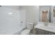 This bathroom features a shower and tub combo, a toilet, and a gray vanity at 16159 W Maui Ln, Surprise, AZ 85379