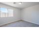 Bright bedroom featuring neutral walls, carpet flooring, and a sunlit window for a welcoming space at 16159 W Maui Ln, Surprise, AZ 85379