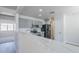 This is a modern kitchen with grey cabinets, stainless steel appliances, and a white countertop at 16159 W Maui Ln, Surprise, AZ 85379