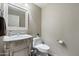 Charming powder room features an ornate mirror, white vanity, and decorative accents at 16202 N 61St Ave, Glendale, AZ 85306