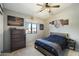 Bedroom features a comfortable bed, dresser, and window with plenty of natural light at 16202 N 61St Ave, Glendale, AZ 85306