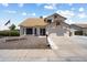 Traditional home featuring a well-maintained yard, attached garage, and classic architectural details at 16202 N 61St Ave, Glendale, AZ 85306