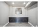 The basement features built-in dark gray cabinets and countertops for storage and functionality at 1712 E Joelle Dr, Casa Grande, AZ 85122