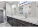 Bathroom with double vanity, large mirror and stylish lighting fixtures at 1712 E Joelle Dr, Casa Grande, AZ 85122