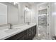 Bathroom with double vanity, large mirror and doorway to the shower/toilet room at 1712 E Joelle Dr, Casa Grande, AZ 85122