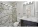 Updated bathroom showcasing a glass shower, modern vanity, and a bright mirror at 1712 E Joelle Dr, Casa Grande, AZ 85122
