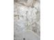 Walk-in shower features stone-look tile walls, a rain shower head and tiled floors at 1712 E Joelle Dr, Casa Grande, AZ 85122