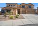 Stunning two-story house with three car garage and low maintenance front yard at 1712 E Joelle Dr, Casa Grande, AZ 85122