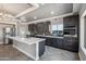 Gourmet kitchen features stainless appliances, dark cabinets, and a white countertops at 1712 E Joelle Dr, Casa Grande, AZ 85122