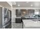 Modern kitchen features stainless steel appliances, backsplash, and bright countertops at 1712 E Joelle Dr, Casa Grande, AZ 85122