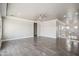 Spacious living room features wood-look tile flooring, neutral paint, and modern railing at 1712 E Joelle Dr, Casa Grande, AZ 85122