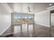 Open-concept living room features a ceiling fan, natural lighting, and backyard access at 1712 E Joelle Dr, Casa Grande, AZ 85122