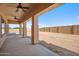 Covered patio area with ceiling fans overlooking an expansive, undeveloped backyard at 1712 E Joelle Dr, Casa Grande, AZ 85122