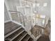 Beautiful staircase features modern railings and views of the entrance of the home at 1712 E Joelle Dr, Casa Grande, AZ 85122