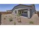 Beautiful backyard featuring desert landscaping and a covered patio, perfect for outdoor enjoyment at 17557 W Victory St, Goodyear, AZ 85338