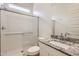 Bathroom featuring granite countertops, modern vanity, and a glass-enclosed shower at 17557 W Victory St, Goodyear, AZ 85338