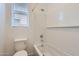 Bright bathroom featuring a shower and tub combination with white subway tile at 17557 W Victory St, Goodyear, AZ 85338
