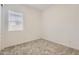 Neutral bedroom featuring a window for natural light and plush carpeting at 17557 W Victory St, Goodyear, AZ 85338