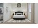Bright bedroom boasts a modern chandelier, neutral decor and tones creating a comfortable and inviting atmosphere at 17557 W Victory St, Goodyear, AZ 85338