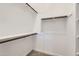 Spacious walk-in closet with built-in shelving and rods, ready for ample storage solutions at 17557 W Victory St, Goodyear, AZ 85338