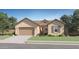 Charming single-story home with a well-manicured lawn and attached two-car garage at 17557 W Victory St, Goodyear, AZ 85338