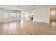 Bright and airy open-concept living space with tile flooring and a kitchen island at 17557 W Victory St, Goodyear, AZ 85338