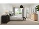 Bright main bedroom with a plush bed, side tables, and ample natural light, creating a peaceful atmosphere at 17557 W Victory St, Goodyear, AZ 85338