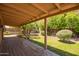 A covered back patio offers plenty of room to relax outdoors overlooking the well landscaped yard at 1810 N 74Th St, Scottsdale, AZ 85257