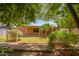 The serene backyard offers a great view of the house and surrounding landscape at 1810 N 74Th St, Scottsdale, AZ 85257