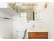 Bathroom features tiled walls, white cabinets, and decorative lighting at 1810 N 74Th St, Scottsdale, AZ 85257