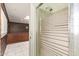 The bathroom has a shower with textured glass and a view of the vintage-style kitchen at 1810 N 74Th St, Scottsdale, AZ 85257