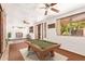 Game room features a pool table, abundant light, and ample room for recreation and entertaining at 1810 N 74Th St, Scottsdale, AZ 85257