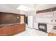 A retro kitchen features pastel cabinets, marbled countertops, wood paneling, and stainless steel appliances at 1810 N 74Th St, Scottsdale, AZ 85257