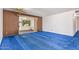 Spacious living room with blue carpet and sliding glass doors to backyard at 1810 N 74Th St, Scottsdale, AZ 85257