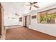 Sunroom features multiple windows, ceiling fans and neutral flooring at 1810 N 74Th St, Scottsdale, AZ 85257