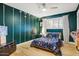 Unique bedroom featuring football field theme, hardwood floors, and natural lighting at 1831 E Rovey Ave, Phoenix, AZ 85016