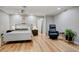 Bright bedroom featuring neutral colors, hardwood floors, and ceiling fan at 1831 E Rovey Ave, Phoenix, AZ 85016
