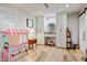 Bright bedroom with hardwood floors, built in storage, and a playful ice cream shop at 1831 E Rovey Ave, Phoenix, AZ 85016