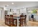 Open kitchen with barstool seating at the island and stainless appliances at 1831 E Rovey Ave, Phoenix, AZ 85016