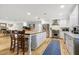 Bright kitchen with a large island, stainless steel appliances, and hardwood flooring at 1831 E Rovey Ave, Phoenix, AZ 85016