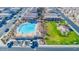 Aerial view of a community pool and green space surrounded by residential homes and streets at 1840 S Follett Way, Gilbert, AZ 85295
