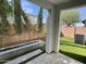 Outdoor backyard area with a linear fireplace, small trees, and artificial turf at 1840 S Follett Way, Gilbert, AZ 85295