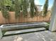 Outdoor backyard area with a linear fireplace, small trees, and artificial turf at 1840 S Follett Way, Gilbert, AZ 85295