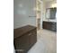 The bathroom features wood cabinets, hard surface countertops, and a walk-in closet at 1840 S Follett Way, Gilbert, AZ 85295