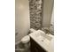 Stylish half bathroom featuring a modern vanity, white countertop, and decorative mirror at 1840 S Follett Way, Gilbert, AZ 85295